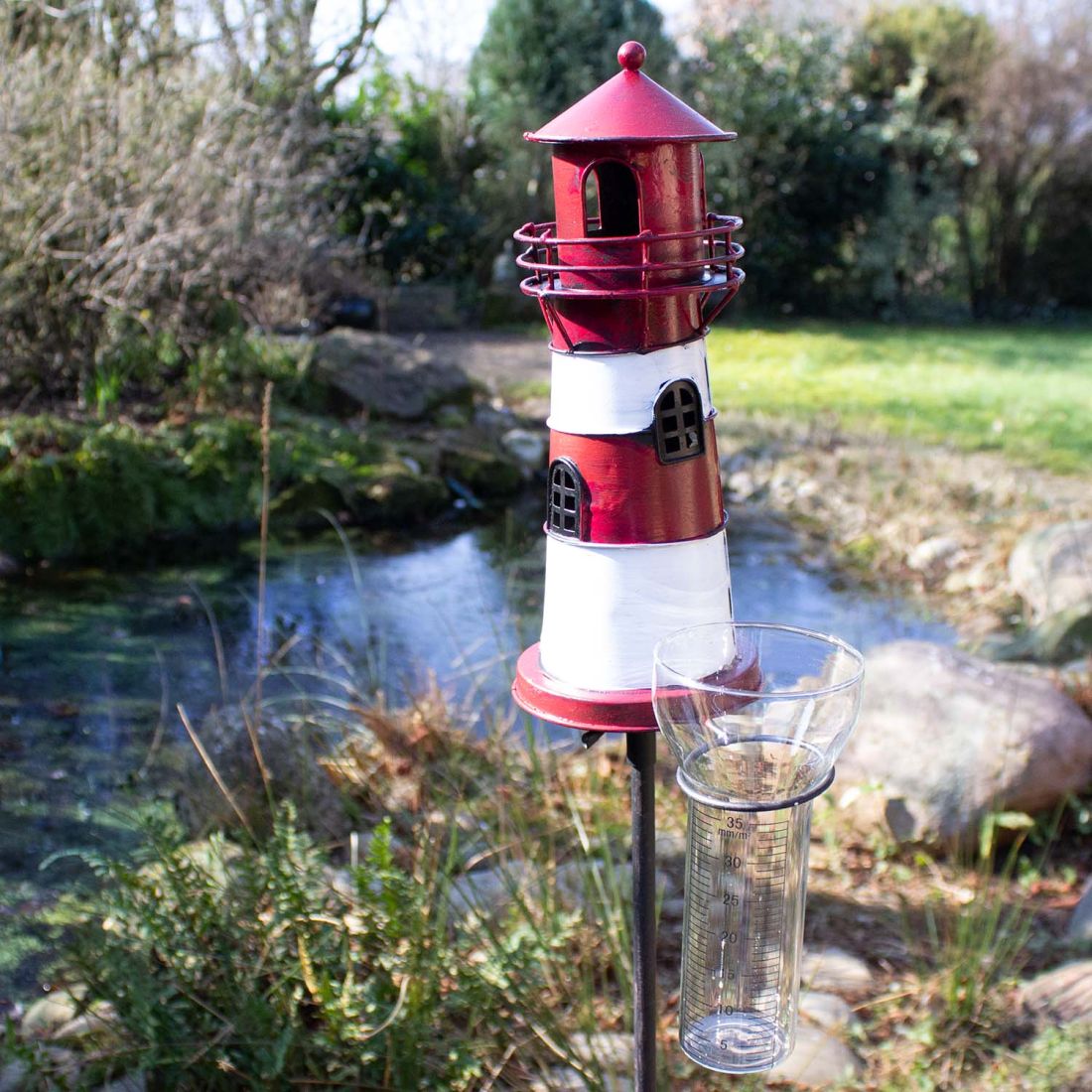 Regenmesser Leuchtturm mit Leuchtfeuer rot